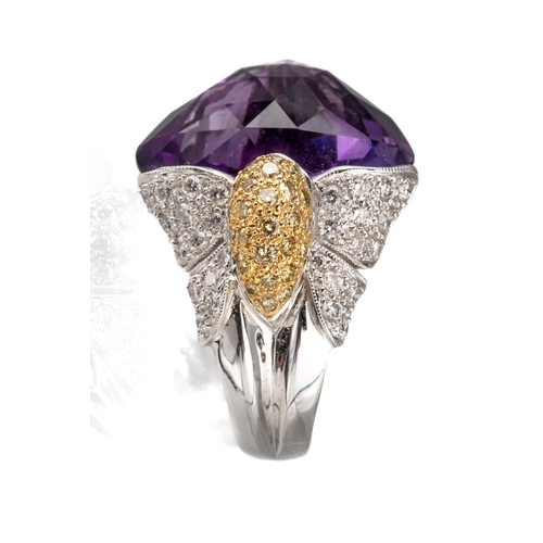 77 - An 18ct white gold diamond and amethyst dress ring, set with a large faceted heart shaped amethyst, ... 