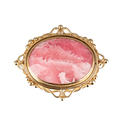 78 - A 9ct yellow gold oval swivel brooch set with rhodochrosite to one side and black onyx to the other,... 