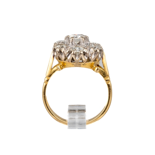 85 - An 18ct yellow gold and diamond seven-stone cluster ring, set with round brilliant-cut diamonds appr... 