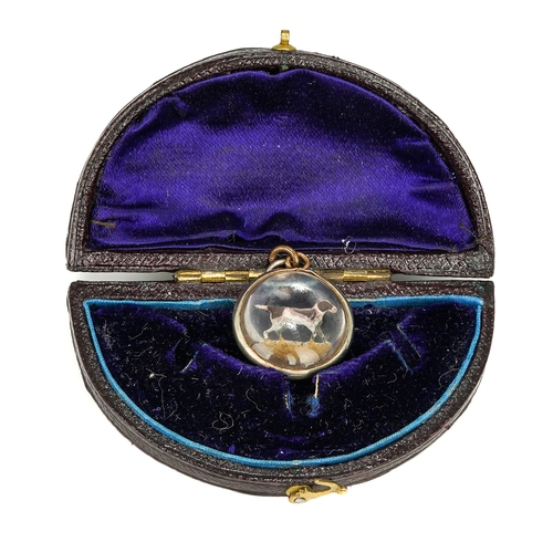 87 - A late 19th/early 20th century reverse painted crystal circular pendant, depicting a hound, approx 1... 