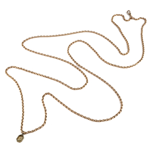 95 - A 9ct yellow gold guard chain, approx 80cm long, with a base metal and paste charm, total gross weig... 