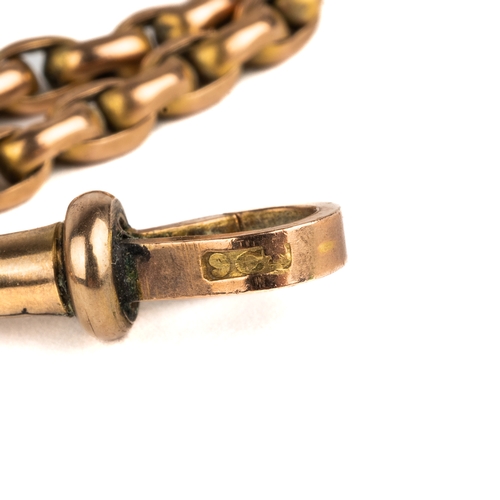 95 - A 9ct yellow gold guard chain, approx 80cm long, with a base metal and paste charm, total gross weig... 