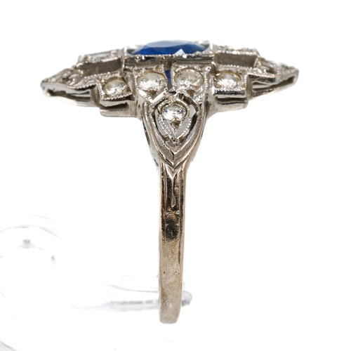 102 - An Art Deco platinum sapphire and diamond dress ring, the central round cut sapphire approx 6.2mm di... 