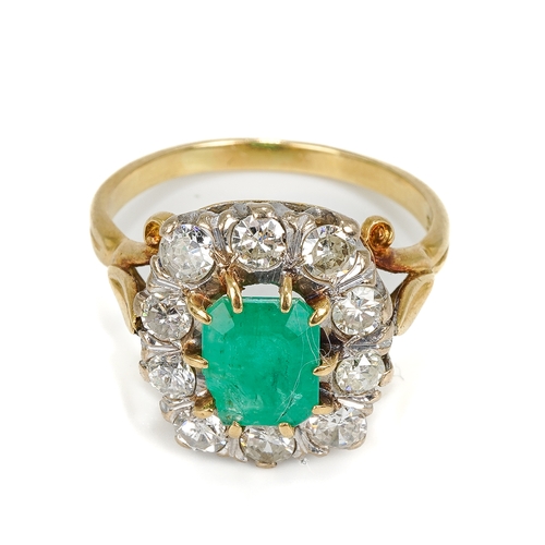 114 - An 18ct yellow gold emerald and diamond cluster ring, the step-cut emerald surrounded by ten round d... 