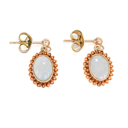 116 - A pair of 9ct yellow gold and opal earrings, oval cabochon opals in rope-twist borders, post and but... 