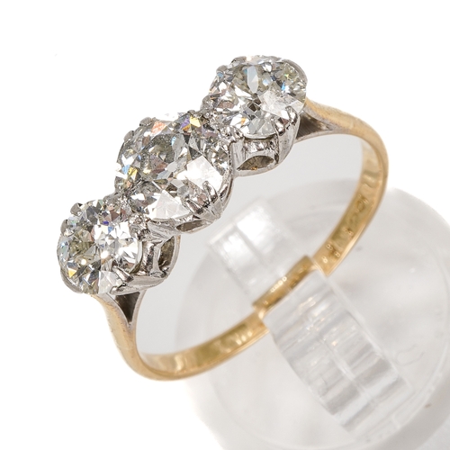 121 - An 18ct yellow gold and diamond three stone ring, set with old-cut diamonds, the centre stone approx... 