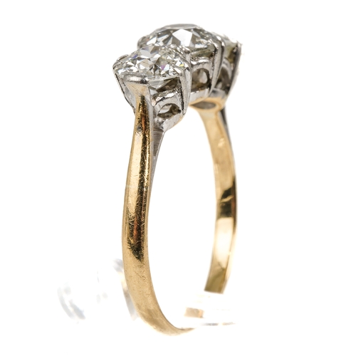 121 - An 18ct yellow gold and diamond three stone ring, set with old-cut diamonds, the centre stone approx... 