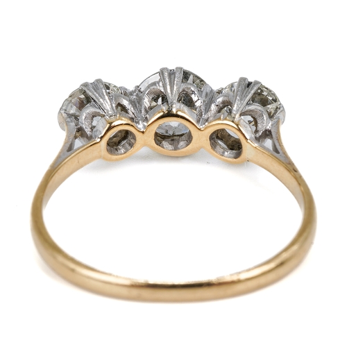 121 - An 18ct yellow gold and diamond three stone ring, set with old-cut diamonds, the centre stone approx... 