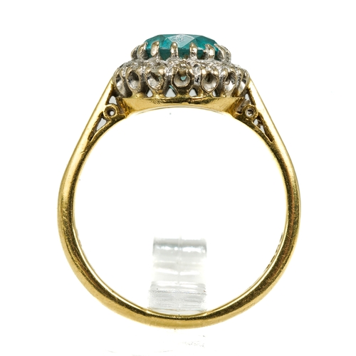 129 - An 18ct yellow gold zircon and diamond cluster ring, the round-cut blue zircon within a border of sm... 