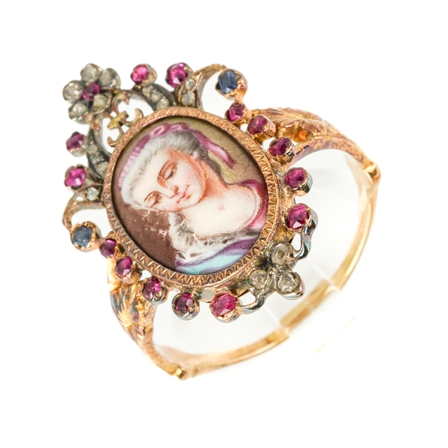 134 - An early 19th century yellow gold gem-set portrait ring, set with an oval portrait of a lady painted... 