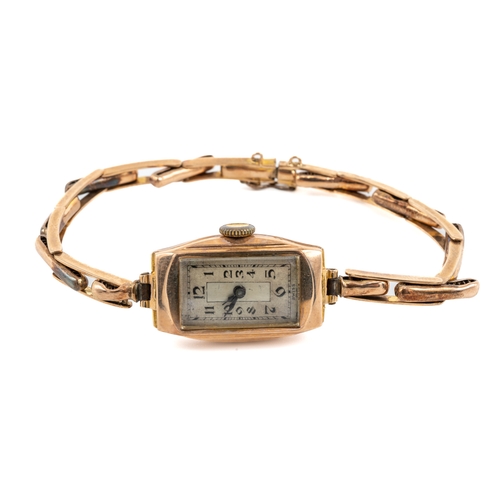 148 - A ladies 9ct yellow gold wristwatch, the rectangular dial with Art Deco Arabic numerals, expandable ... 