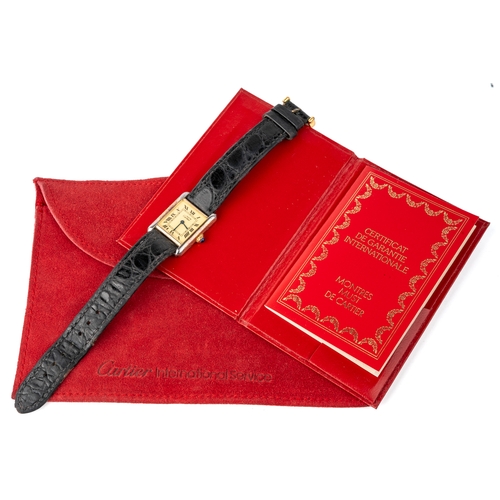 153 - A ladies Must De Cartier Tank silver-gilt wristwatch, original black croc strap, with pouch and pape... 