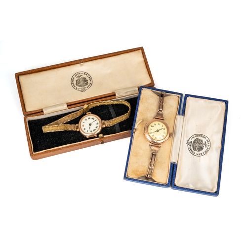 156 - A ladies 9ct yellow gold circular wristwatch, on a gold plated strap; and another, with a gold plate... 