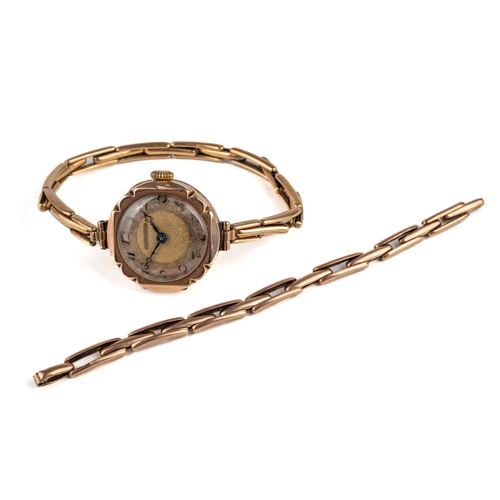 166 - A ladies 1920s 9ct yellow gold wristwatch, Arabic numerals, expanding bracelet, with extra strap, to... 