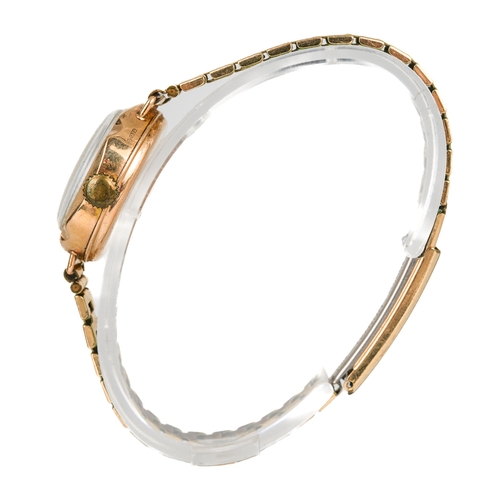 170 - A 9ct gold cased ladies wristwatch, mother of pearl chapter ring, Arabic numerals, gold plated strap... 