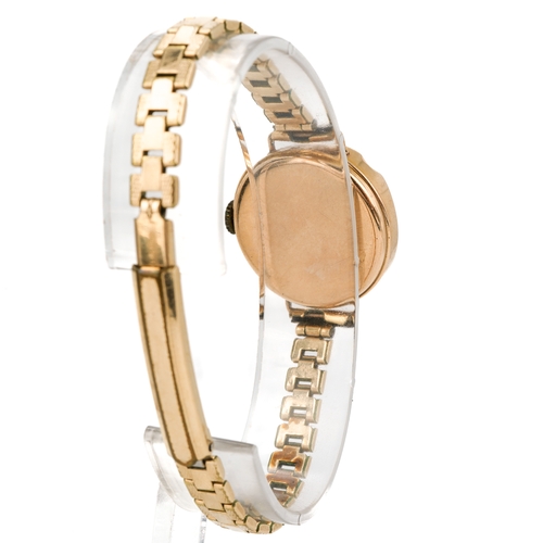 170 - A 9ct gold cased ladies wristwatch, mother of pearl chapter ring, Arabic numerals, gold plated strap... 