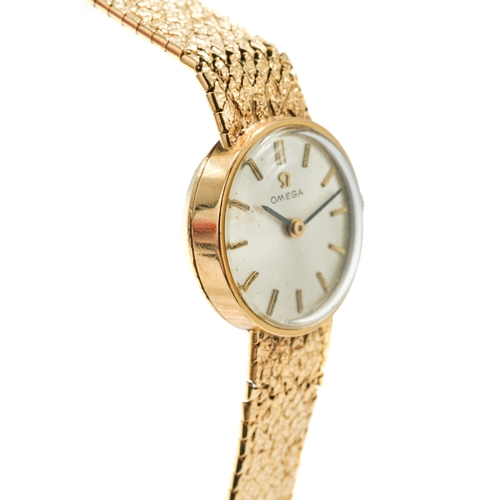 172 - A ladies 9ct yellow gold Omega wristwatch, the circular silvered dial with baton indicators, integra... 