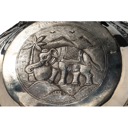 181 - A large Burmese silver bowl, 19th century, repousse decorated with 7 headed snake and  figures with ... 