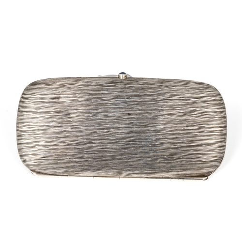 190 - An Art Deco continental silver rounded rectangular cigarette case, the textured case of plain design... 