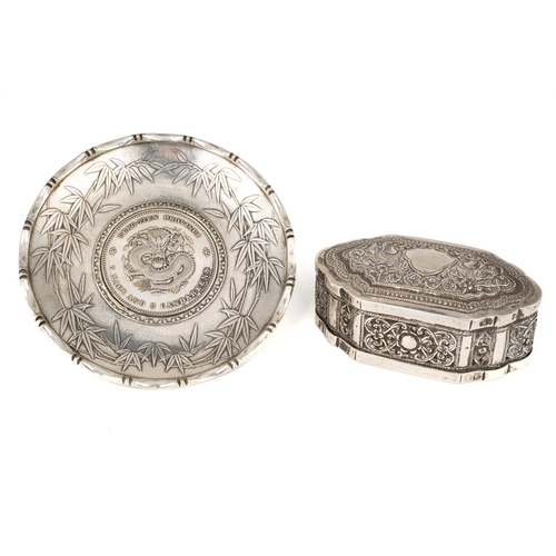 191 - A late 19th centruy Far Eastern silver snuff box, cast with foliate scrolls, approx 7.5cm; together ... 