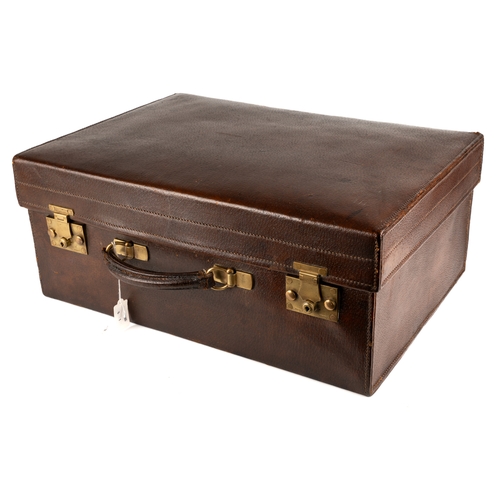 192 - Asprey of London - a George V silver-gilt leather travelling vanity case, comprising two hand brushe... 