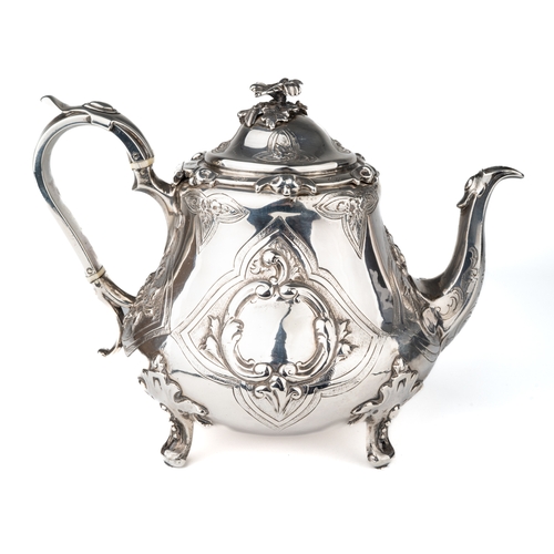 197 - An early Victorian silver teapot, the hinged domed cover with floral finial, the body embossed with ... 