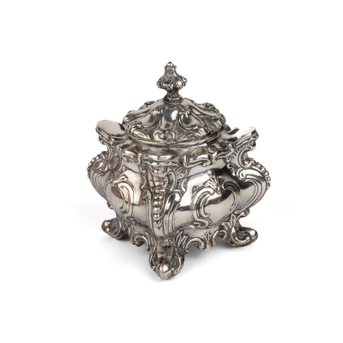 206 - A Victorian silver-plated tea caddy, of shaped square form cast with foliate scrolls, the cover with... 