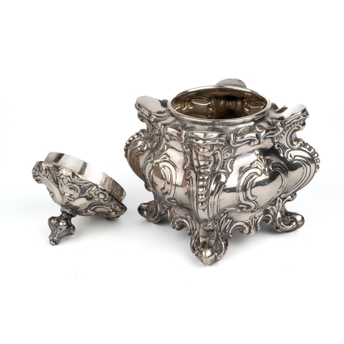 206 - A Victorian silver-plated tea caddy, of shaped square form cast with foliate scrolls, the cover with... 