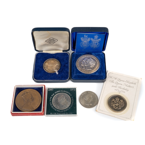 225 - A collection of coins, including a sterling silver Royal Anniversary Medal, designed by David Cornel... 