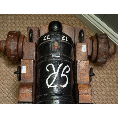 237 - An English solid cast iron cannon, believed to come from HMS Drake. Repainted approximately  40 year... 