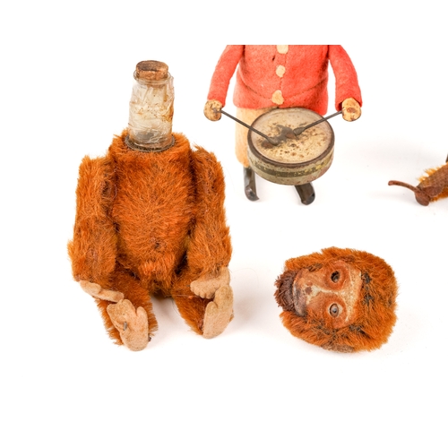 255 - 3 antique Schucko monkey toys to include a mechanical drummer (no key), a yes/no monkey and a perfum... 