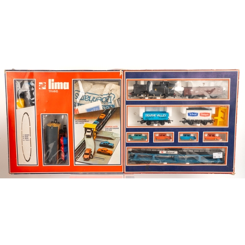 261 - A collection of boxed Lima model trains and associated model railway furniture and die cast cars. Tr... 