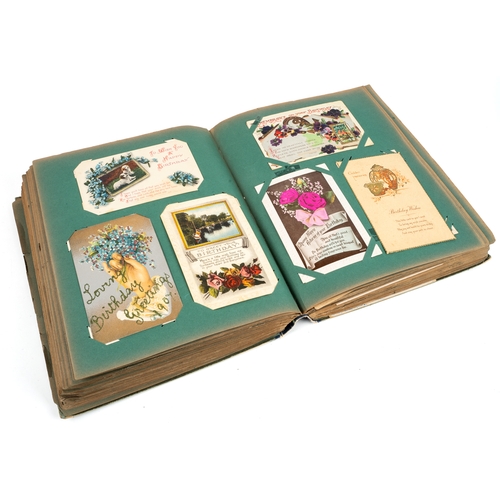 271 - A large post card album, containing approx 500 postcards and birthday cards, some hand tinted, circa... 