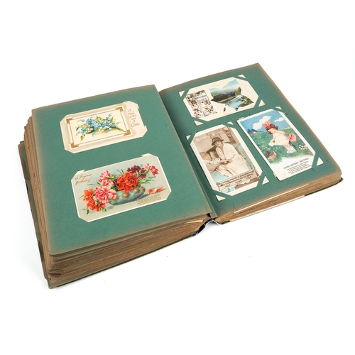 271 - A large post card album, containing approx 500 postcards and birthday cards, some hand tinted, circa... 