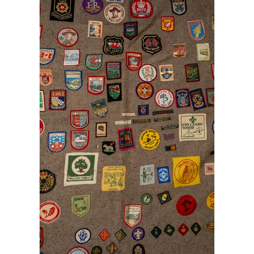 311 - Scouting interest. A Scout blanket, circa 1960s/70s, applied with a large collection of badges