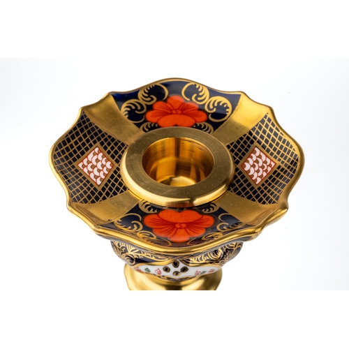 360 - A Royal Crown Derby Old Imari 1128 solid gold band candlestick, heavily gilded with dolphin detail t... 