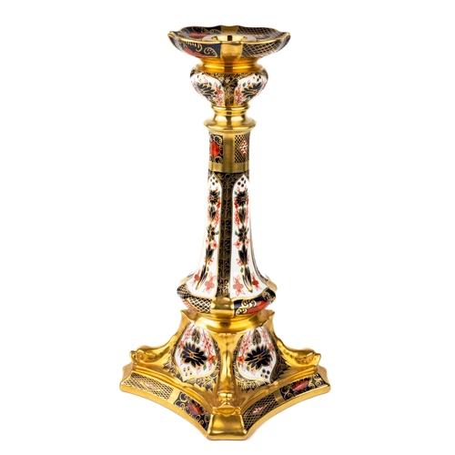 360 - A Royal Crown Derby Old Imari 1128 solid gold band candlestick, heavily gilded with dolphin detail t... 