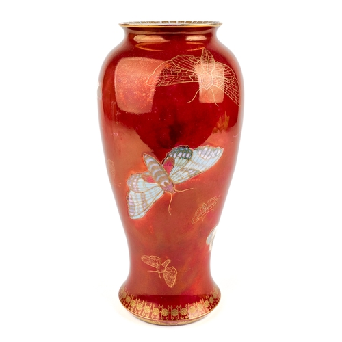 374 - A Carlton Ware ovoid vase, decorated with butterflies and moths on a red ground, black stamp to base... 