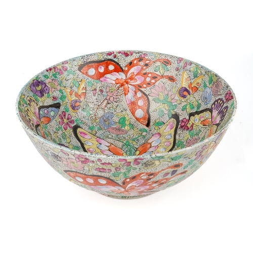 378 - A large Chinese famille rose bowl, enamelled with butterflies, approx 12cm high x 25.5cm diam, six r... 