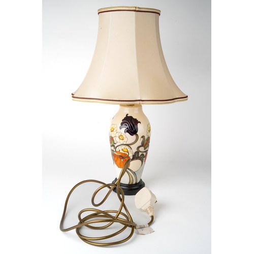 390 - A Moorcroft 'Sandringham Bouquet' pattern lamp, designed by Emma Bossons, on a wooden base, approx 2... 