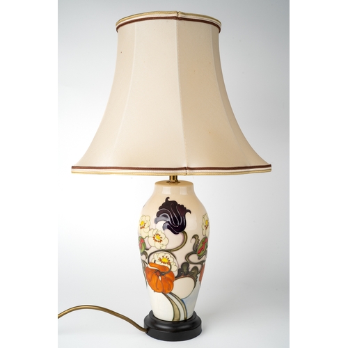 390 - A Moorcroft 'Sandringham Bouquet' pattern lamp, designed by Emma Bossons, on a wooden base, approx 2... 