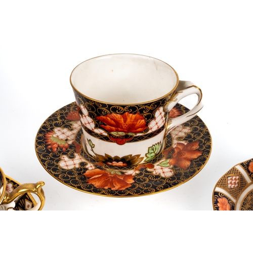 394 - A collection of Royal Crown Derby cups and saucers, including 1283 chocolate cup and saucer, 2451 pa... 