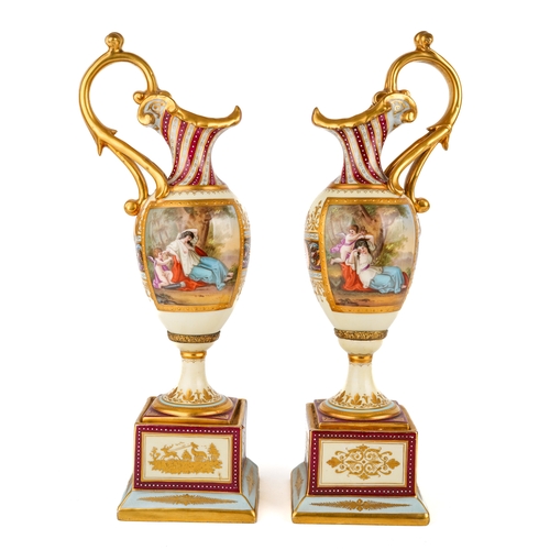 404 - A pair of late 19th century Vienna porcelain pedestal ewers, each of Neo-Classical tapering outline ... 