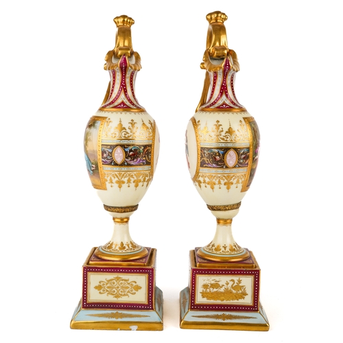 404 - A pair of late 19th century Vienna porcelain pedestal ewers, each of Neo-Classical tapering outline ... 