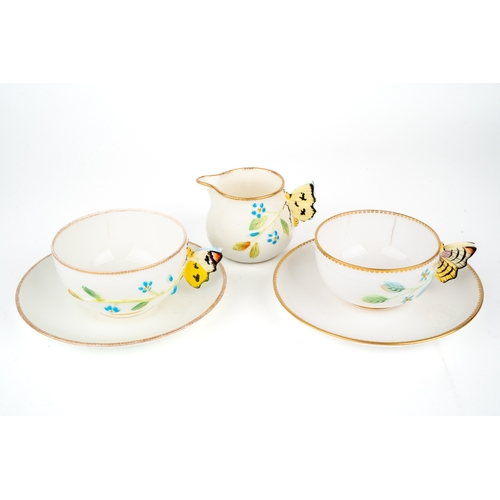 411 - Two Coapland China cups and saucers, butterfly handles, together with a cream jug, marked to base, m... 