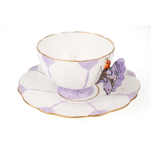 416 - An Aynsley purple butterfly handle cup and saucer, marked to base, Reg No. 765788