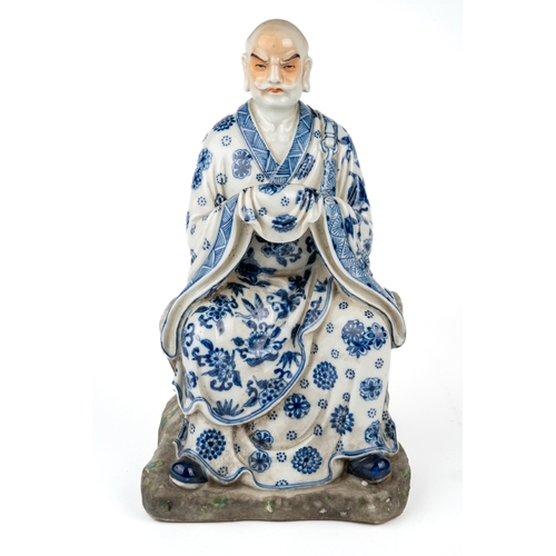 417 - A late 18th/ early 19th century Chinese porcelain hand painted blue and white figure of a seated man... 