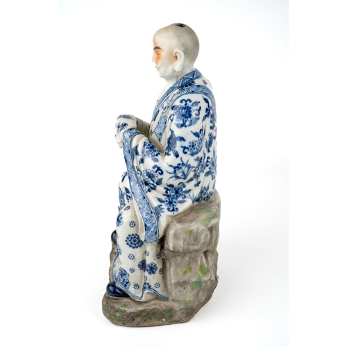 417 - A late 18th/ early 19th century Chinese porcelain hand painted blue and white figure of a seated man... 