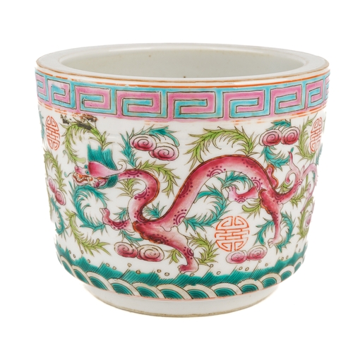 419 - A Chinese polychrome enamelled jardinere, depicting dragons amongst foliage, Greek Key pattern borde... 