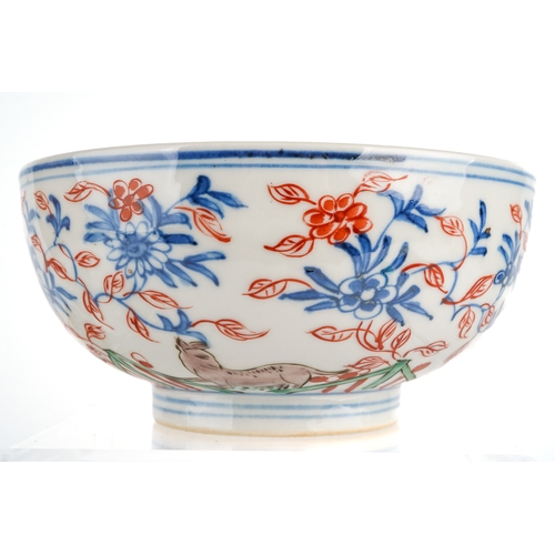 421 - A pair of Chinese bowls, decorated with animals amongst foliage, the inner bowls painted with flower... 